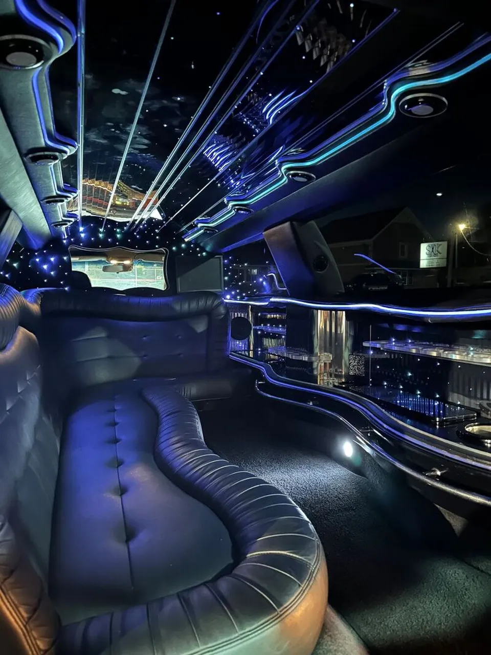 Lincoln Town Car Limousine interior with sofa-style seating, LED accent lighting and starlight or fiber-optic ceiling for limo rental