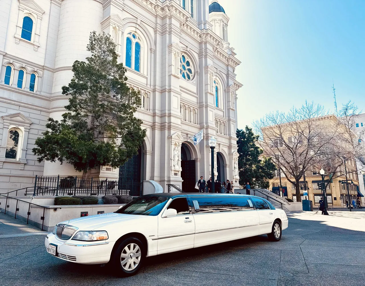 White Lincoln Town Car Limousine with tinted windows for limo rental in Denair, CA