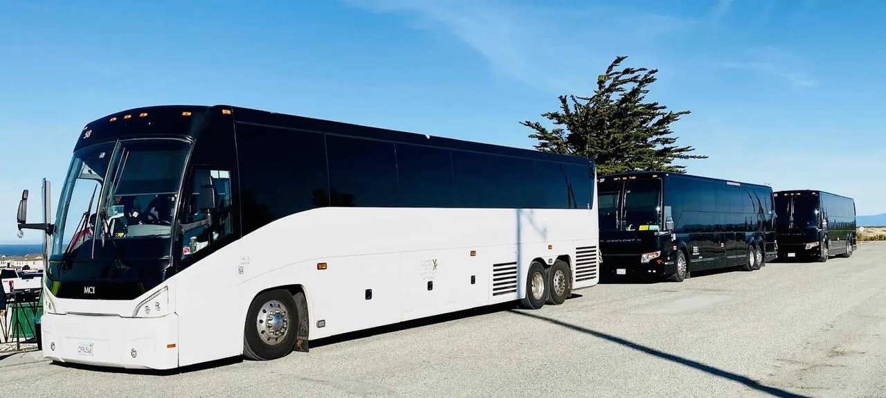 White MCI Motorcoach with tinted windows for charter bus rental in Dutch Flat, CA