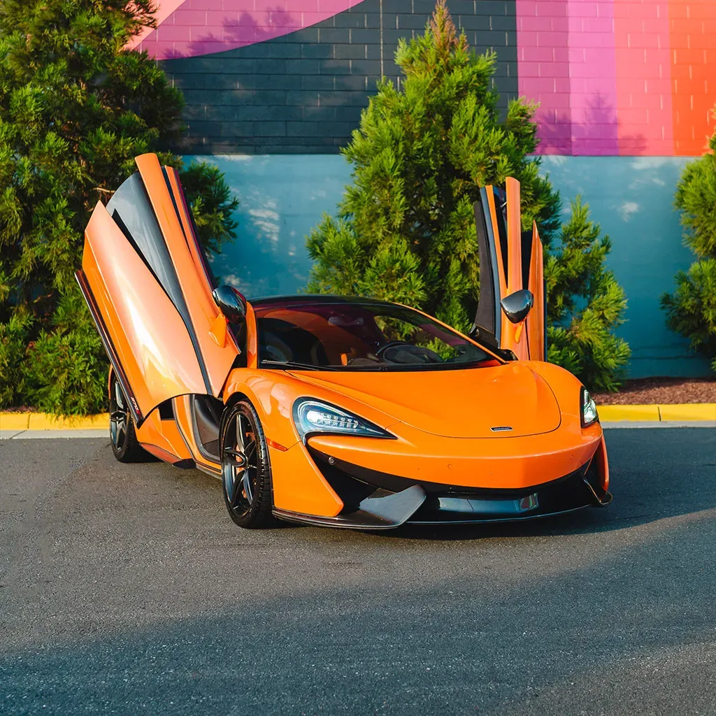 Orange McLaren 570S Ventura for sports car rental