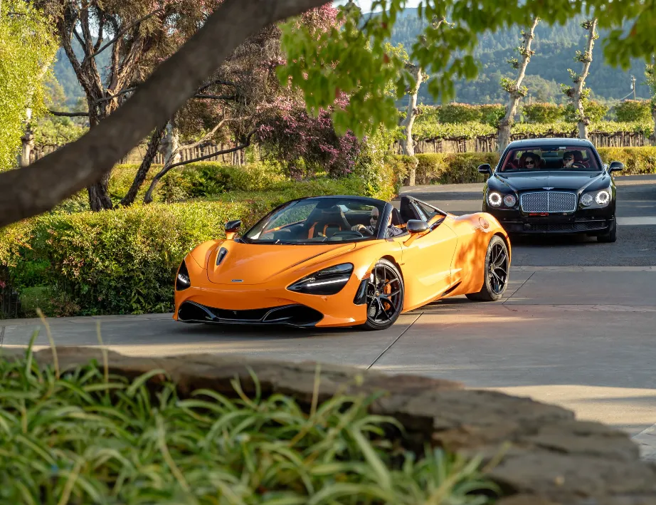 Orange McLaren 720S Performance Spider exterior with convertible roof for exotic and luxury car rental in Napa, CA