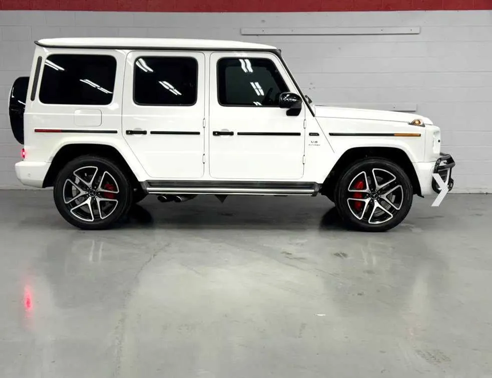 White Mercedes-Benz G Wagon exterior with running boards for exotic and luxury car rental in Southfield, MI