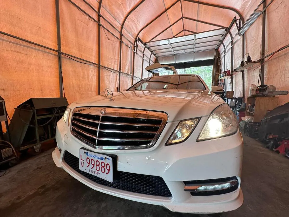 White Mercedes JET Doors Limousine exterior for limo rental