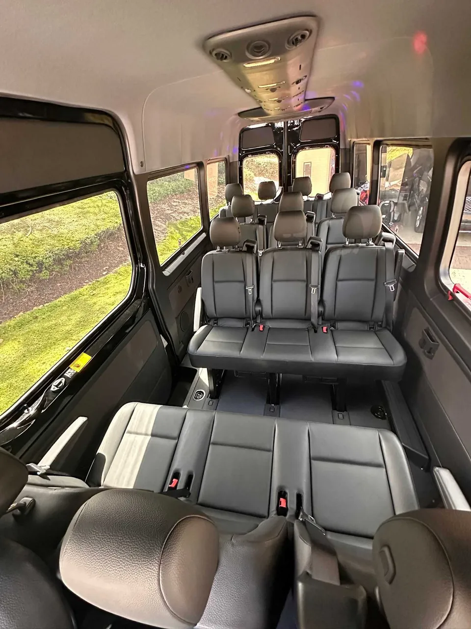 Mercedes-Benz Limousine Sprinter interior with passenger seat belts for party bus rental