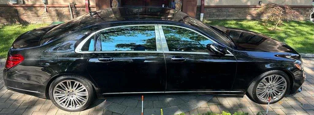 From outside of the black Mercedes-Maybach