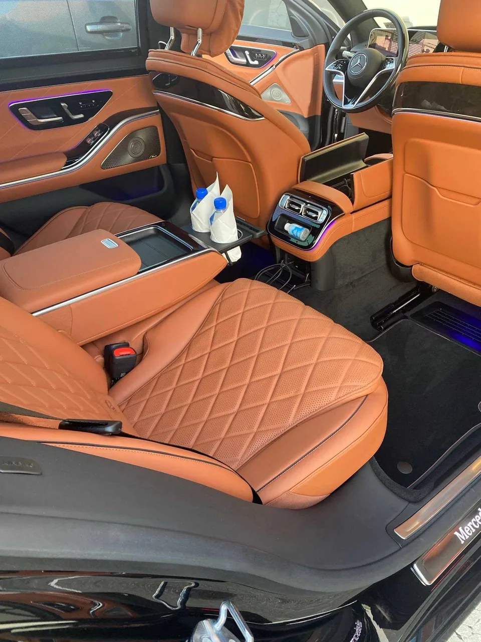 Mercedes-Benz S-Class interior with rear passenger controls and LED accent lighting for wedding car rental