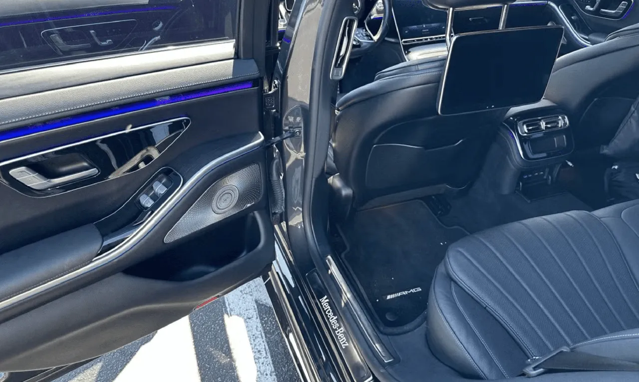 Mercedes-Benz S-Class interior with LED accent lighting and rear-seat entertainment screens for wedding car rental in Los Angeles, CA