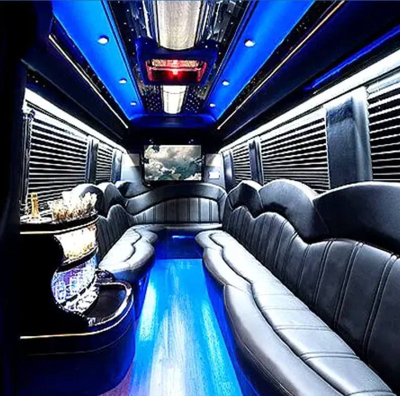 Mercedes-Benz Sprinter Limousine interior with perimeter lounge seating, sofa-style seating and window shades for party bus rental in Hawthorne, CA
