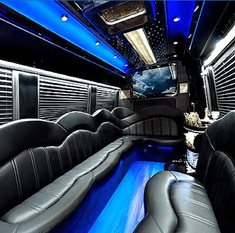 Mercedes-Benz Sprinter Limousine interior with perimeter lounge seating, window shades and LED accent lighting for party bus rental in Hawthorne, CA