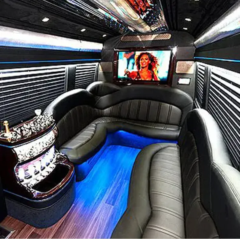 Mercedes-Benz Sprinter Limousine interior with perimeter lounge seating, window shades and LED accent lighting for limo rental in Walnut, CA
