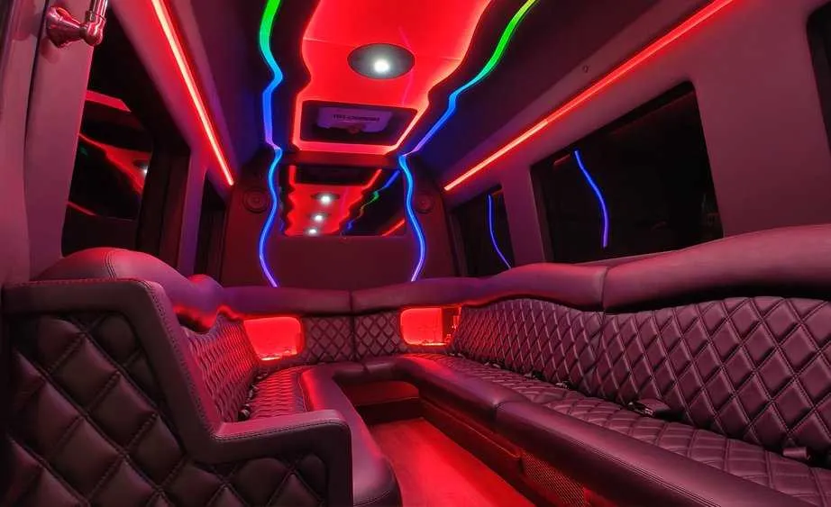Mercedes-Benz Sprinter Limousine interior with perimeter lounge seating and LED accent lighting, photo 5 for limo rental in Dutch Flat, CA