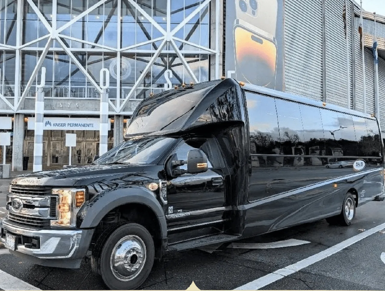 Black 27 Passenger Mini Coach with tinted windows for charter bus rental in Aromas, CA