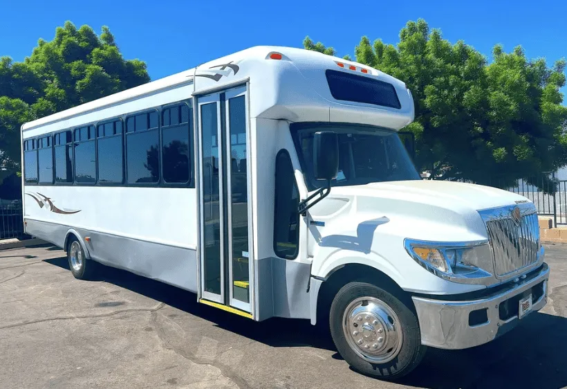 White 28 Passenger Mini Coach for charter bus rental in Paso Robles, CA
