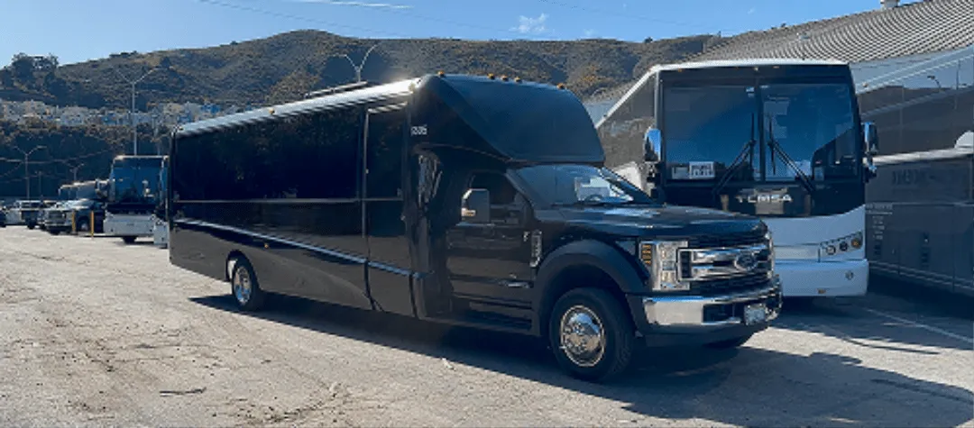 Black 24 Passenger Minibus with tinted windows for charter bus rental in Aptos, CA