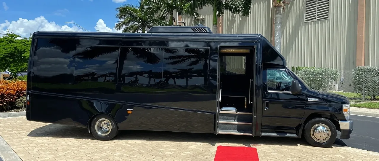 The black 28 Passenger Minibus, ready to rent