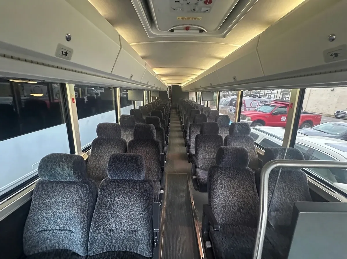 The green 55 Passenger Motor Coach, shot 2