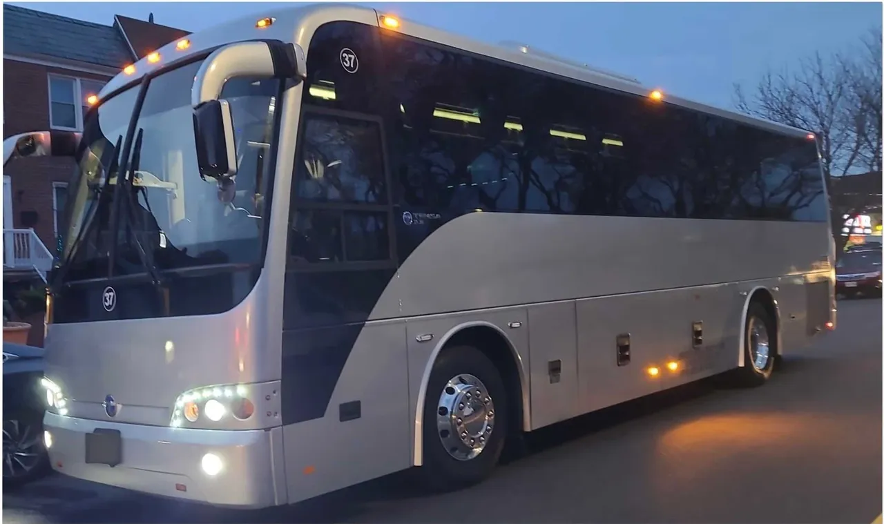 The black 55 Passenger Motor Coach, ready to rent