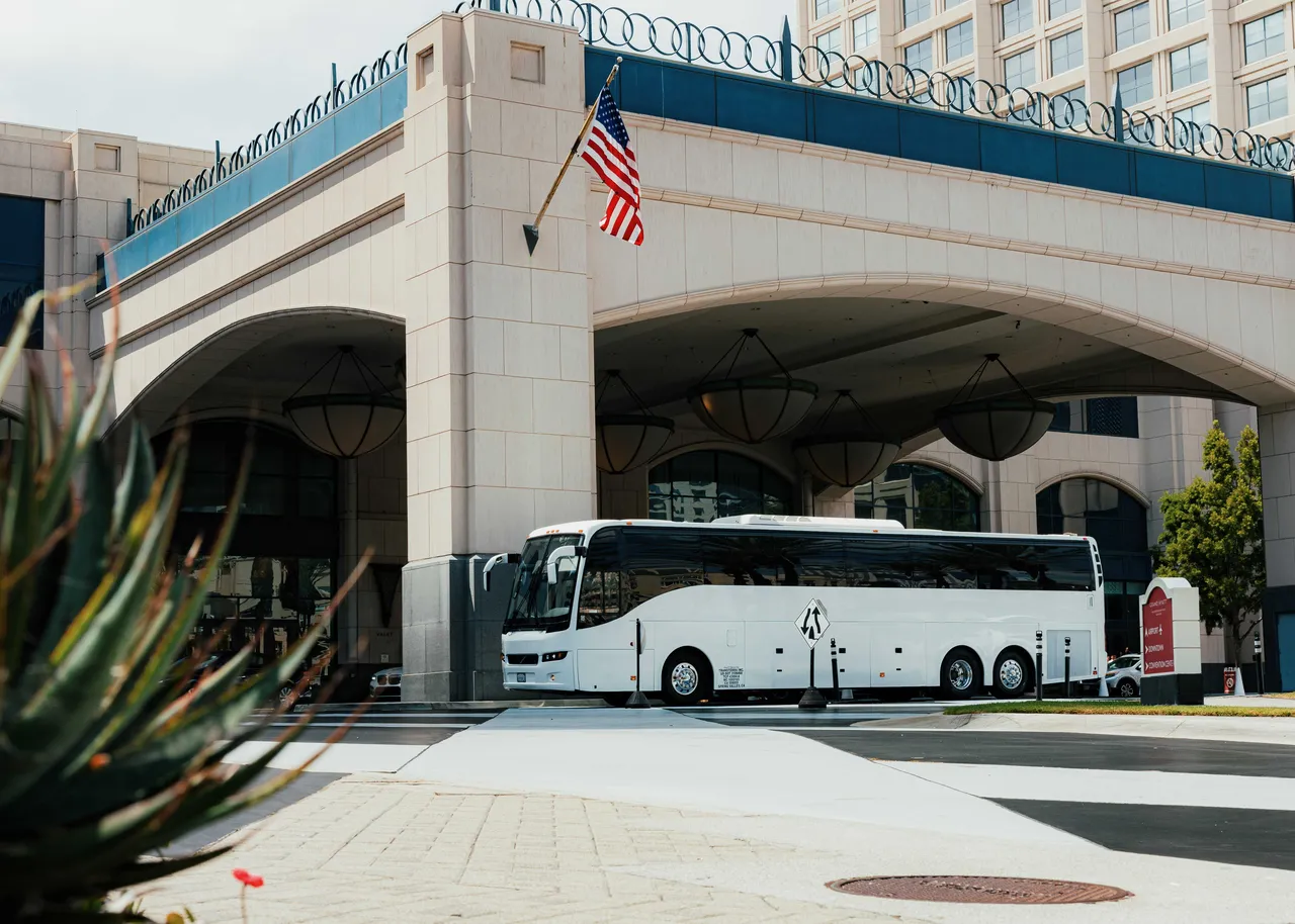 White 56 Passenger Motor Coach for charter bus rental in Spring Valley, CA