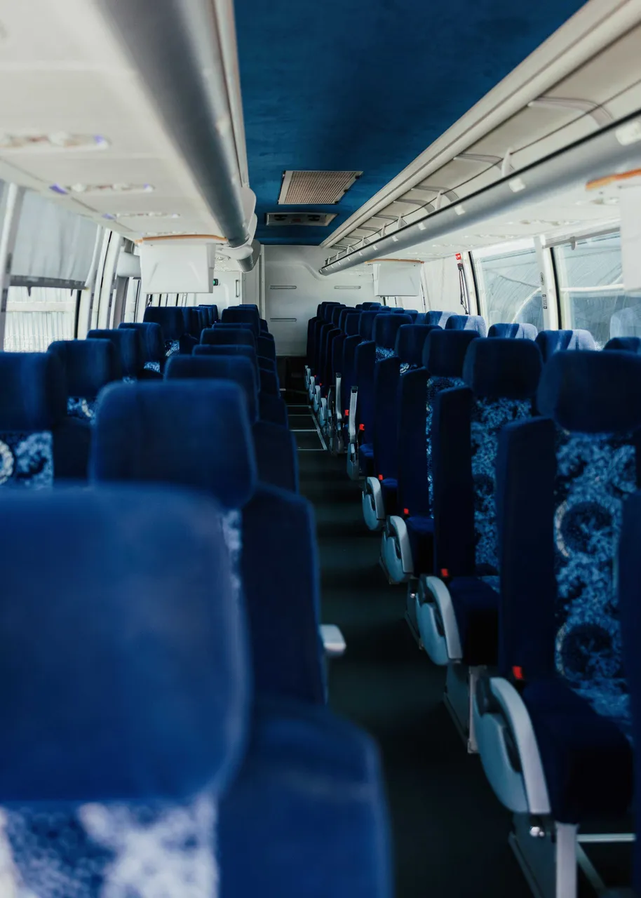 56 Passenger Motor Coach interior with overhead parcel racks, photo 5 for charter bus rental in Hacienda Heights, CA