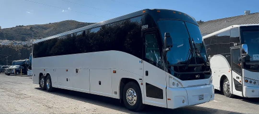 White 40 Passenger Motorcoach with tinted windows for charter bus rental in South San Francisco, CA