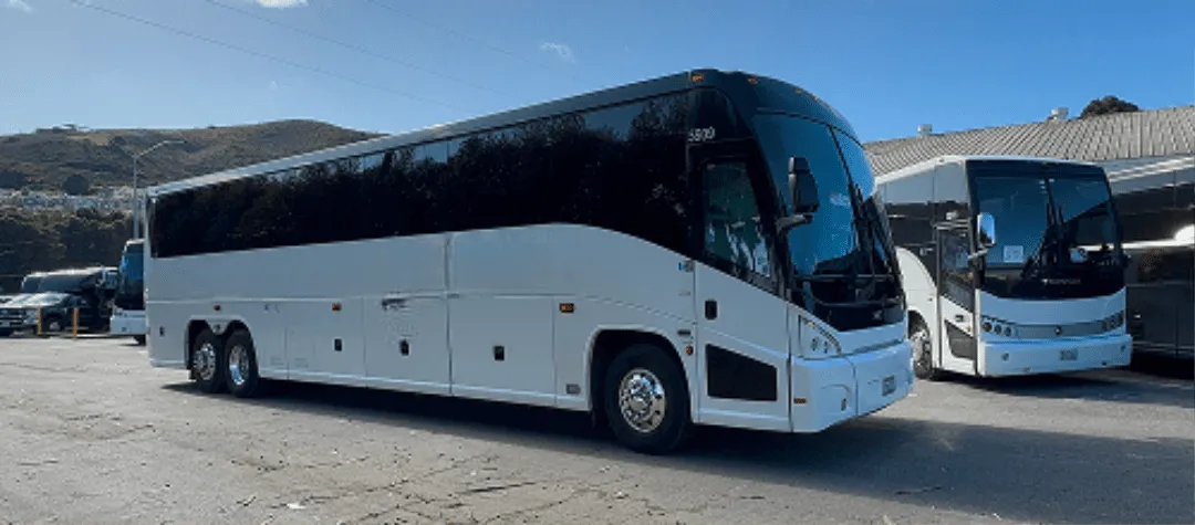 White 56 Passenger Motorcoach with tinted windows for charter bus rental in South San Francisco, CA