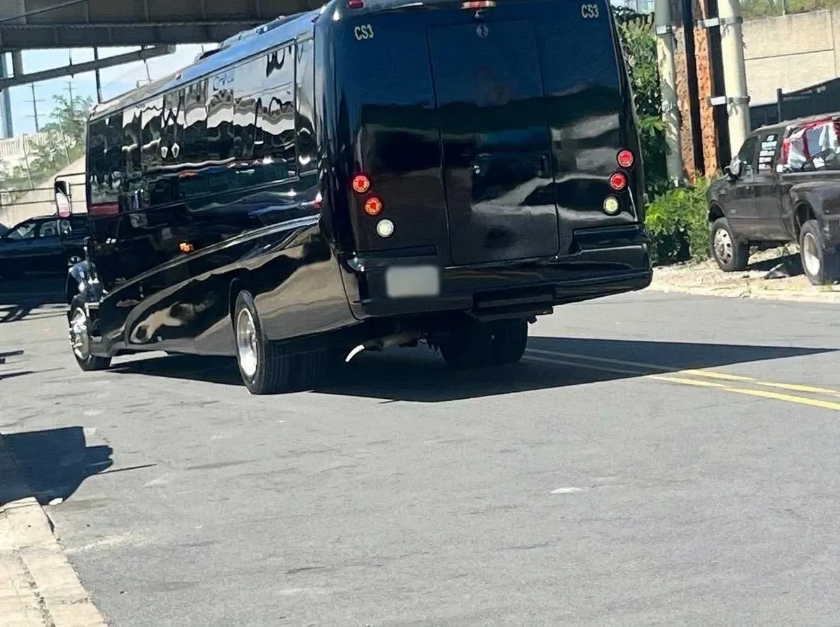 The black 40 Passenger Motorcoach, shot 2