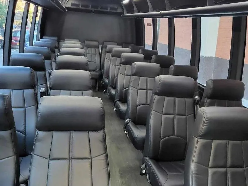 The black 56 Passenger Motorcoach, shot 2