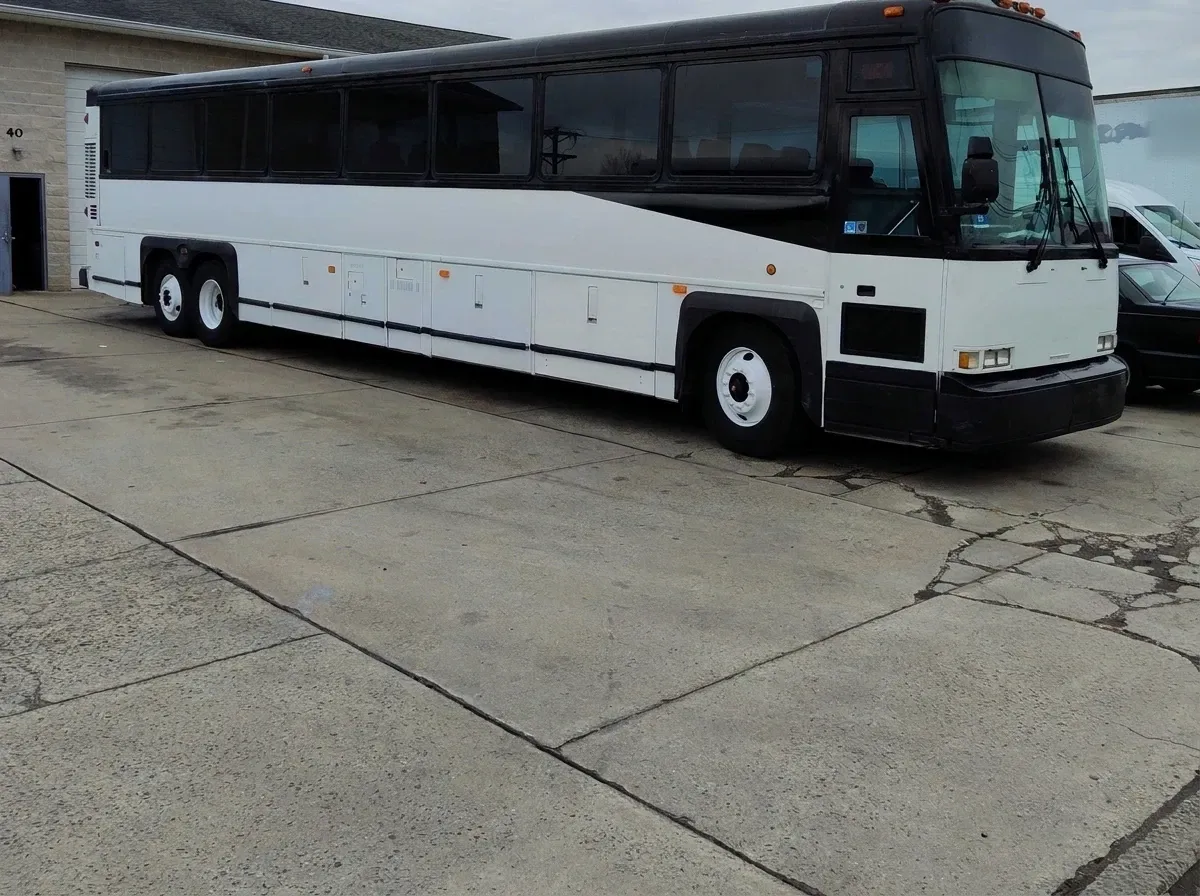The white Motorcoach MCI, ready to rent