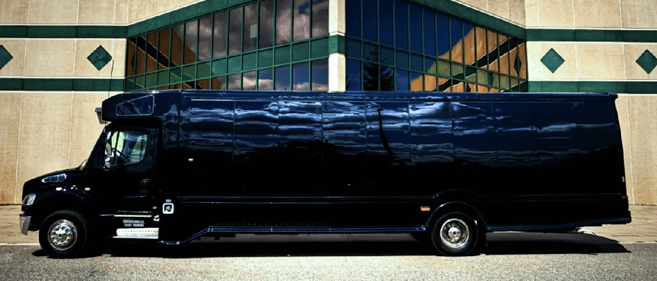 Black 28 Passenger Party Bus exterior with tinted windows for party bus rental in Saint Paul, MN