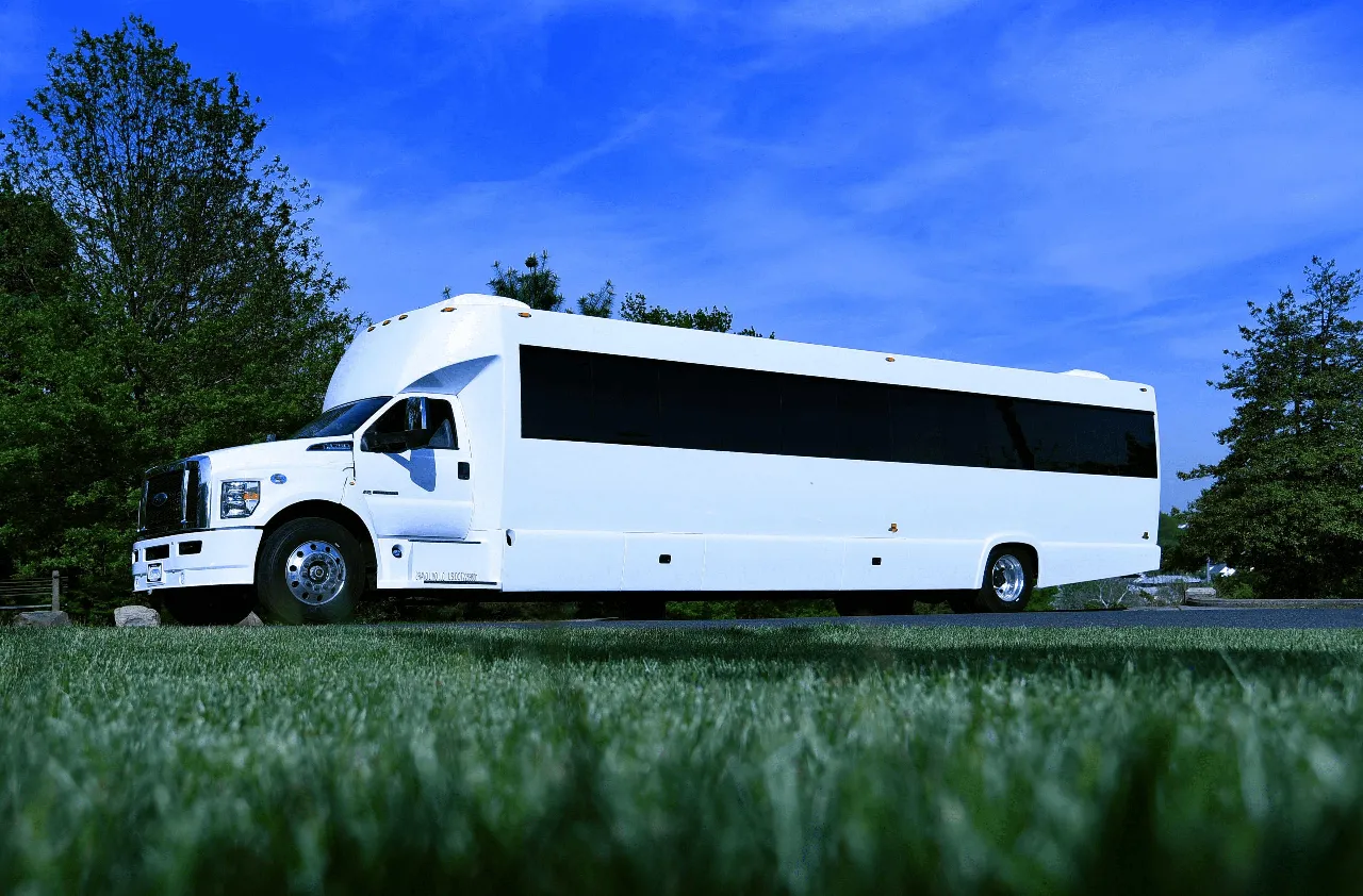 White 50 Passenger Party Bus exterior with tinted windows for party bus rental in West Orange, NJ