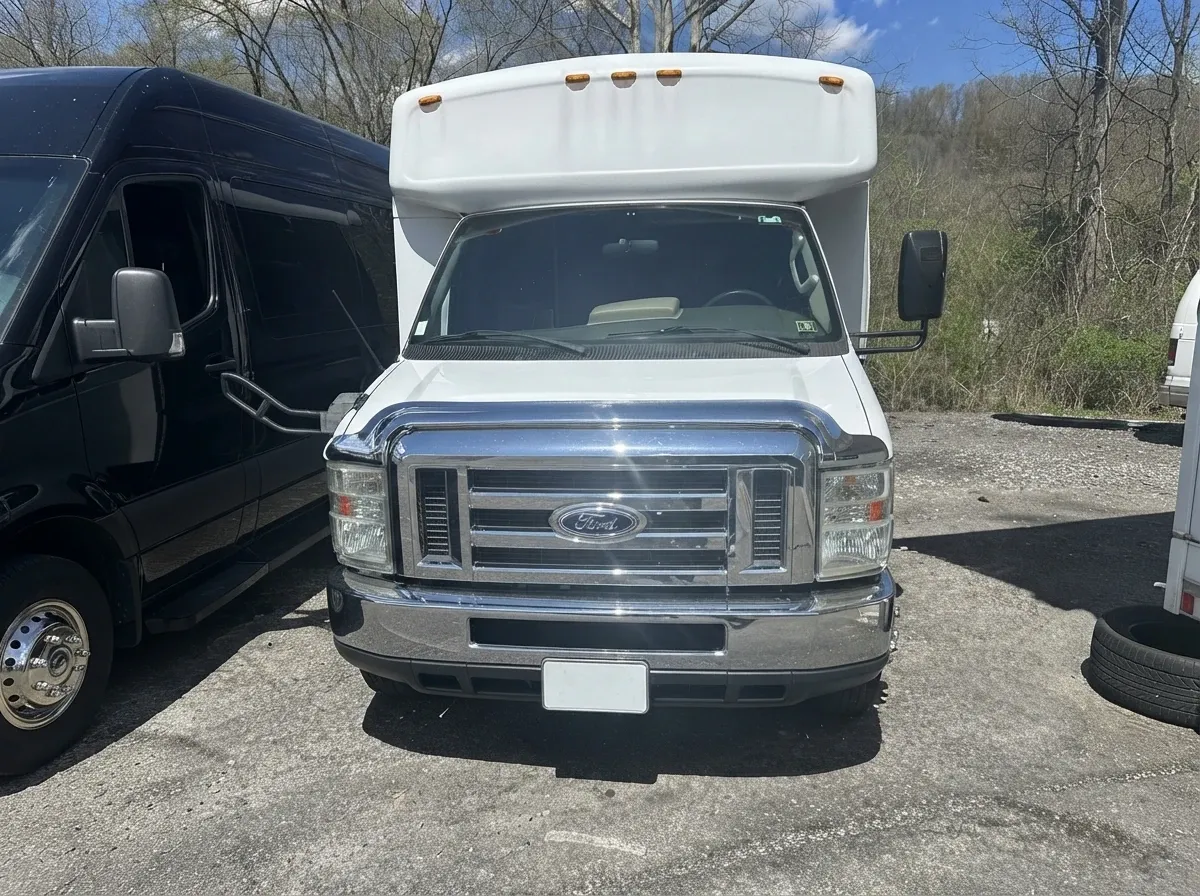 The white 18 Passenger Party Bus, ready to rent