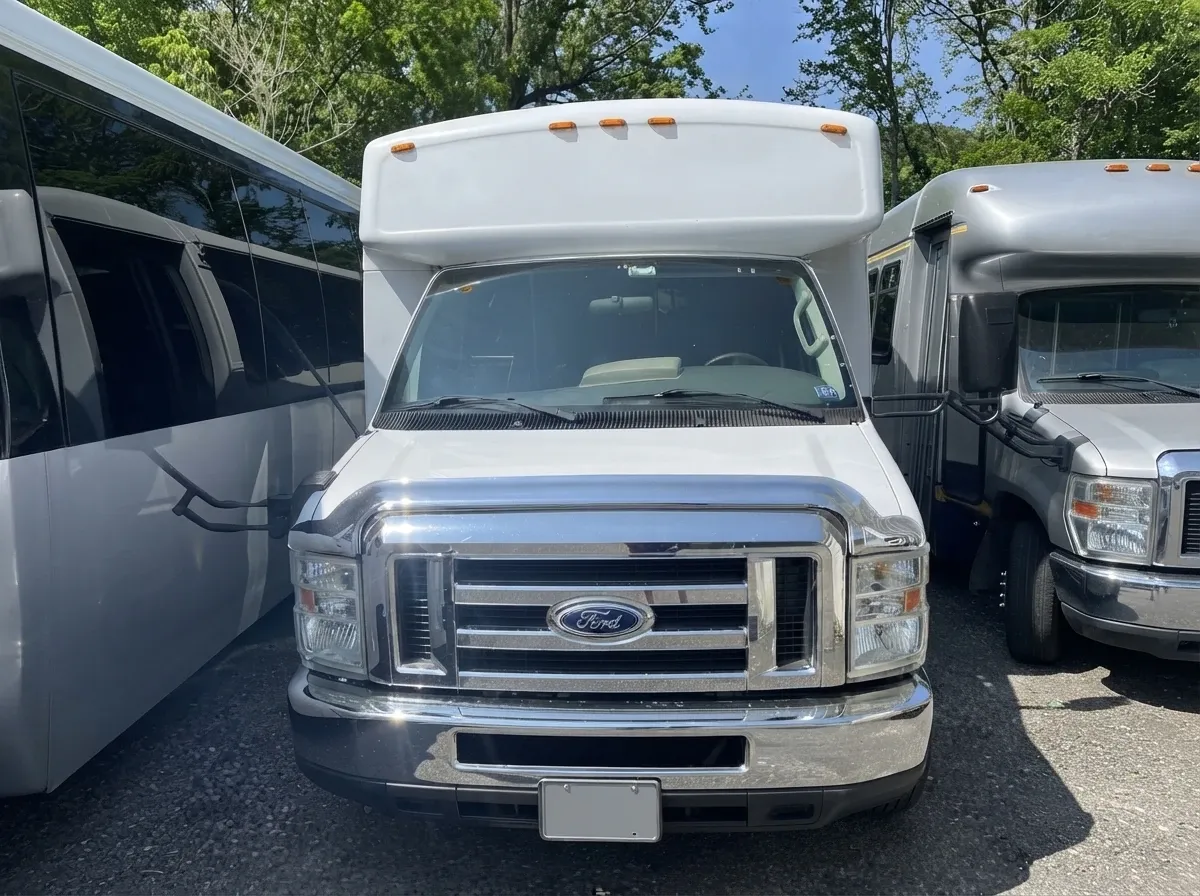 The white 18 Passenger Party Bus, shot 2