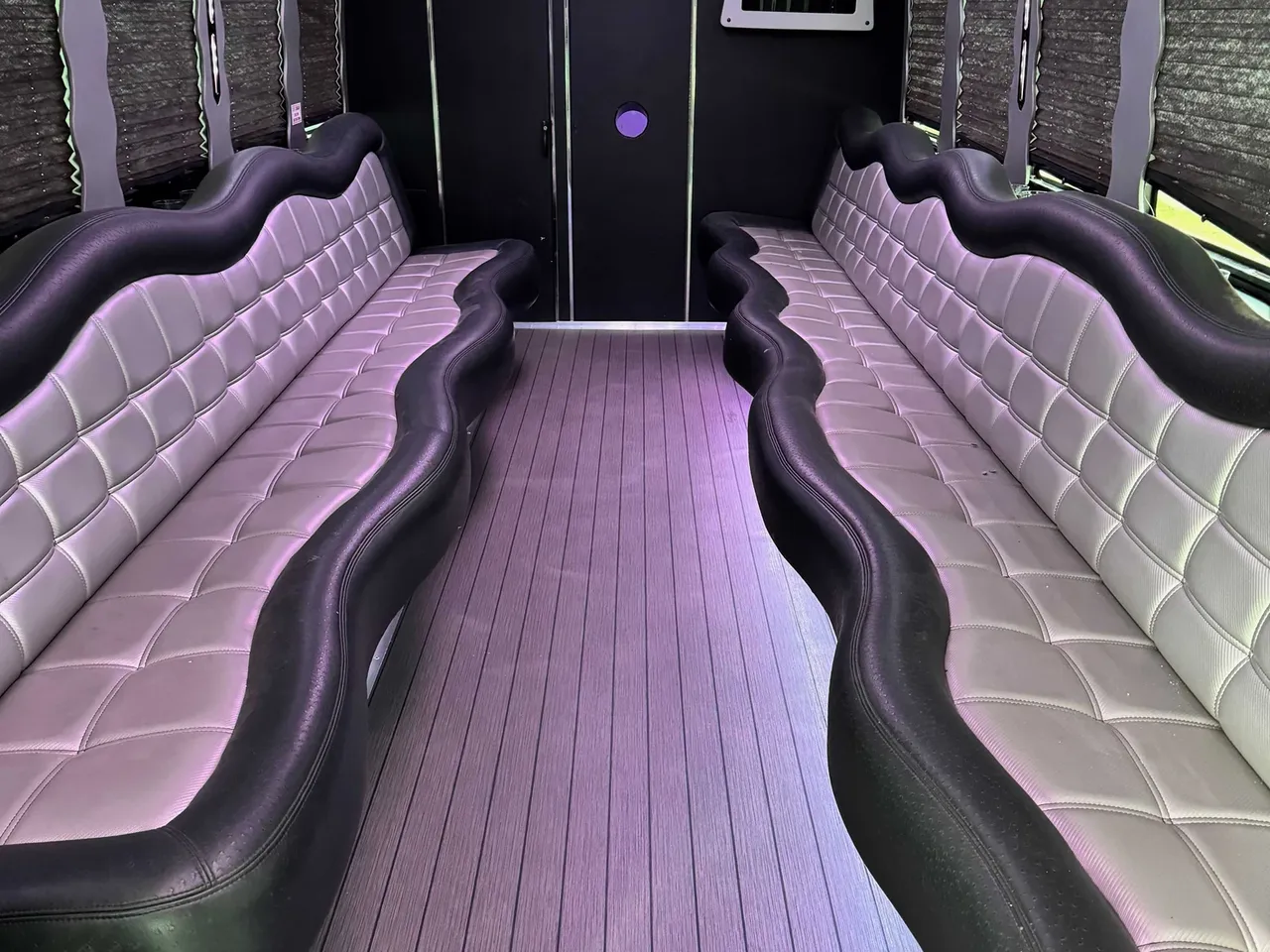 The white 24 Passenger Party Bus, shot 2