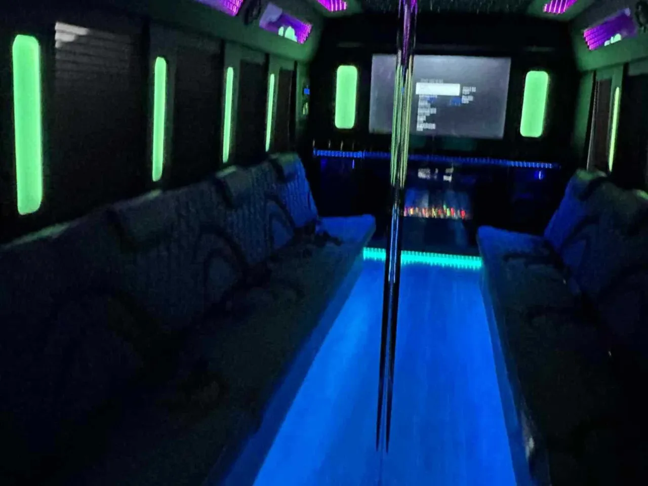 The white 18 Passenger Party Bus, shot 2