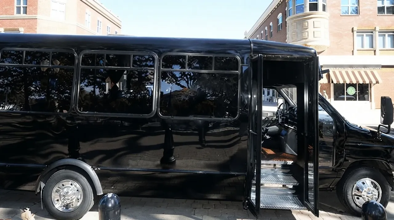 The black 18 Passenger Party Bus, ready to rent