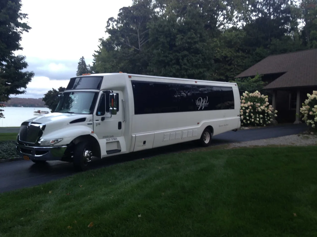 White Party Bus - Dean Martin with tinted windows for party bus rental in Tully, NY