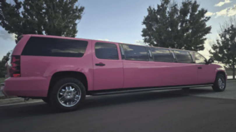 Pink Chevrolet Suburban Limousine with tinted windows for limo rental