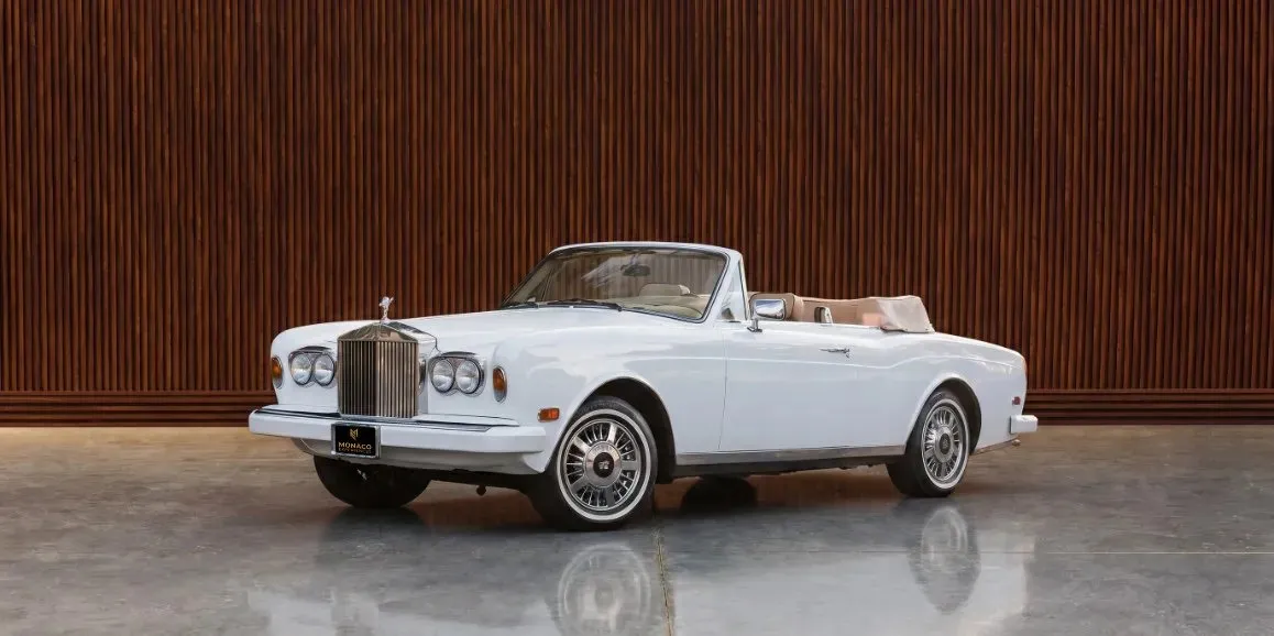 White Rolls-Royce Corniche 1975 with convertible roof for wedding car rental