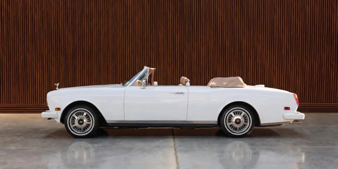 White Rolls-Royce Corniche 1975 exterior with convertible roof for wedding car rental