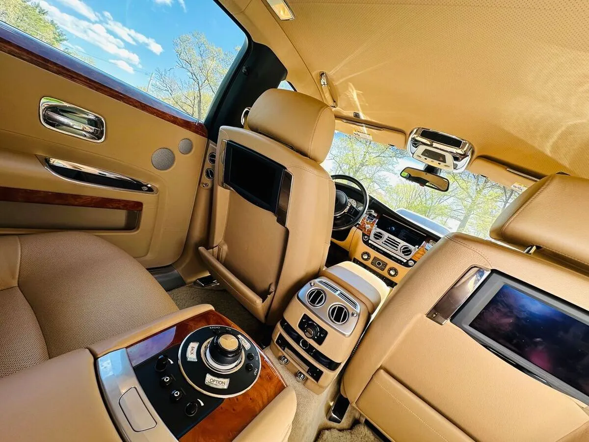 Rolls Royce Ghost Sedan interior with rear-seat entertainment screens for wedding car rental in Lewiston, CA