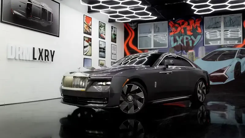 Grey Rolls-Royce Spectre for sports car rental