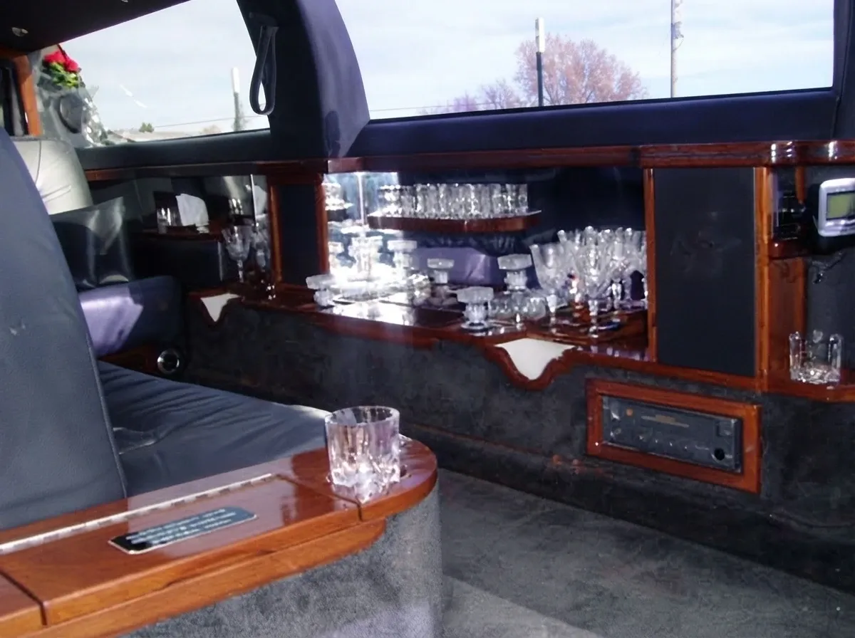 The black Stretch Lincoln Town Car, ready to rent
