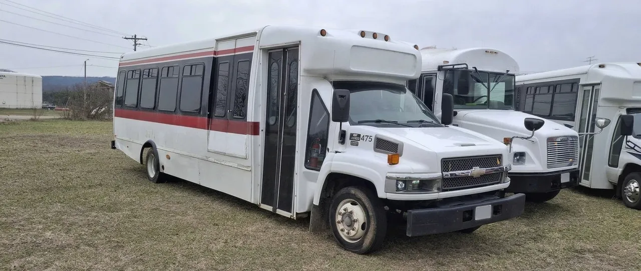The white The Red Line Party Bus, ready to rent