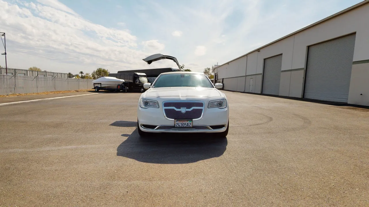 White Chrysler 300 Stretch Limousine for party bus rental in Keyes, CA