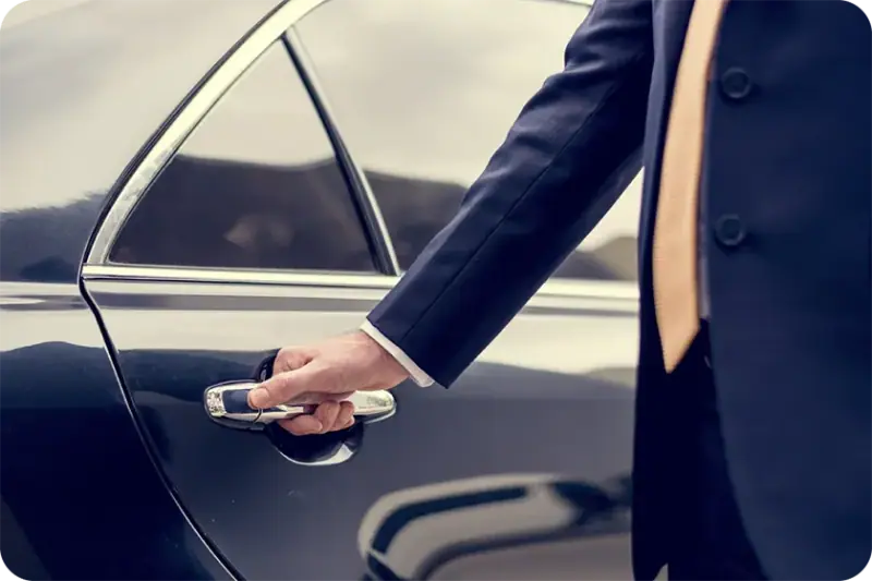 Chauffeur opening the car door — Corporate & VIP Events